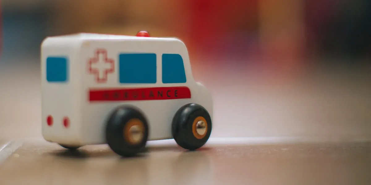 mini toy ambulance on table
