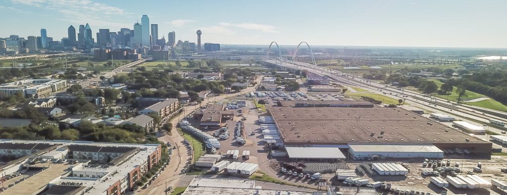 Aerial view of Dallas, Texas, overlooking trucks parked at a warehouse